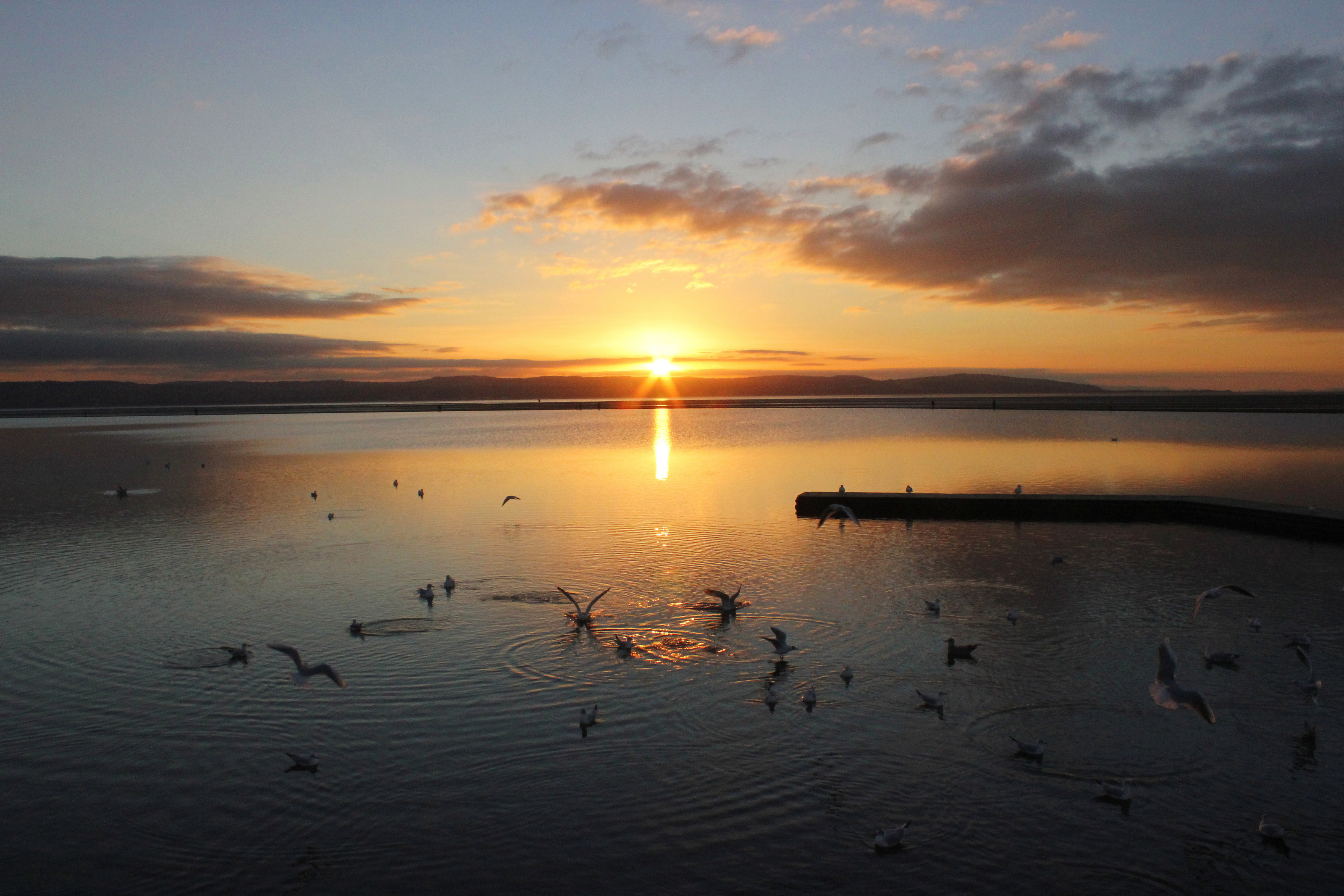 Sunset over the Wirral coast at West Kirby — calm open scenery near placement homes