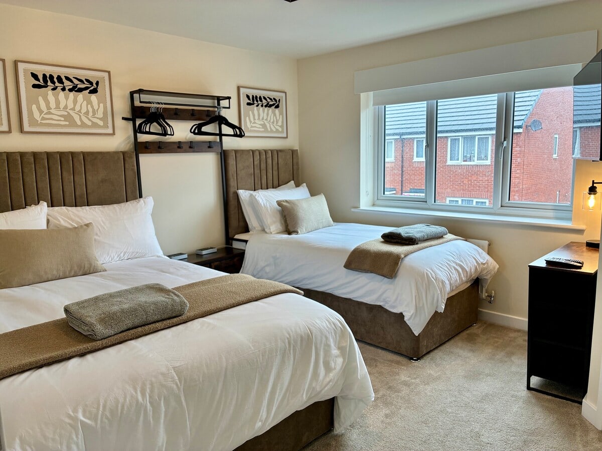 Bedroom 1 at Fairwater House with double and single bed